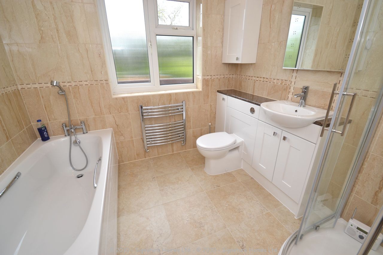 Fitted Bathroom with knock through in Banstead by our bathroom fitters